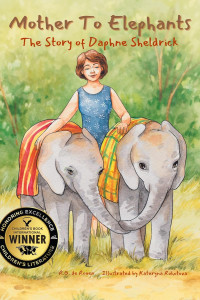 A woman smiles gently, walking between two baby elephants draped in colorful cloths. A "Children's Book Winner" seal is displayed. The tone is warm and nurturing.