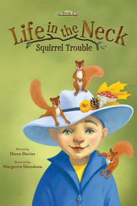 young boy with big white hat with 2 squirrels on it and one squirrel on his shoulder