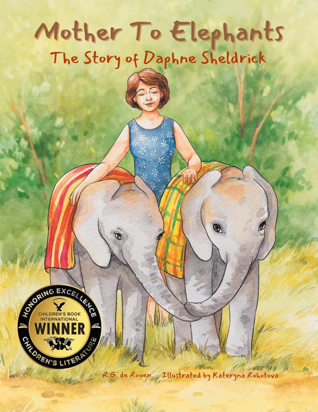A woman smiles gently, walking between two baby elephants draped in colorful cloths. A "Children's Book Winner" seal is displayed. The tone is warm and nurturing.
