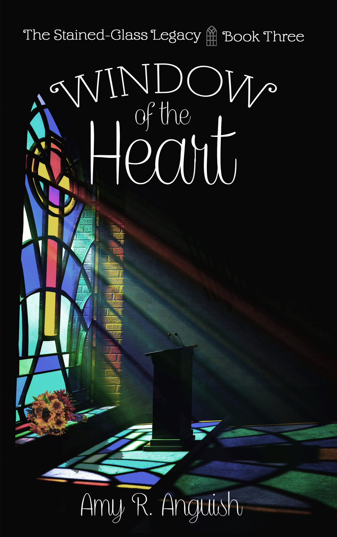 stained-glass window shining down on chapel interior