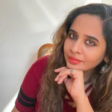 Rochelle Potkar leaning in, her gaze into the camera.